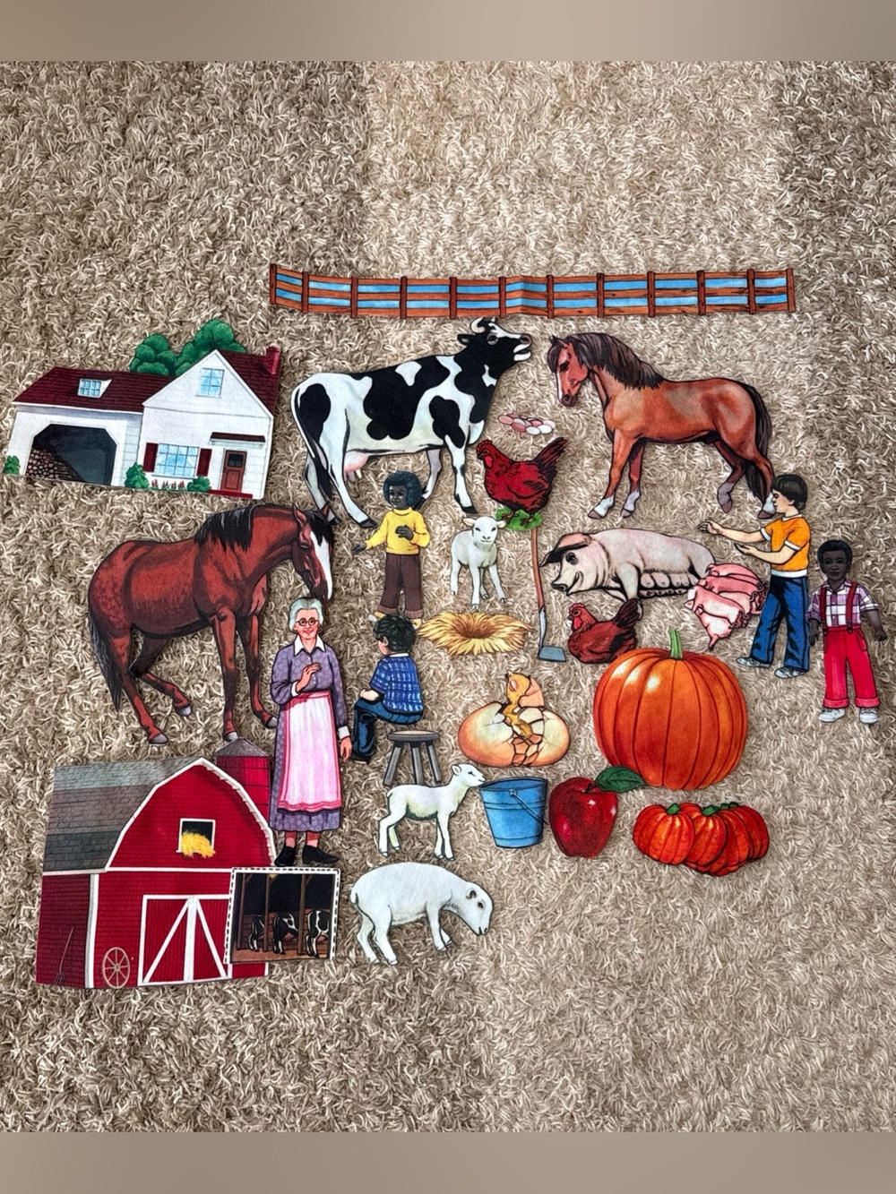Farm family and animals felt cutouts. School learning